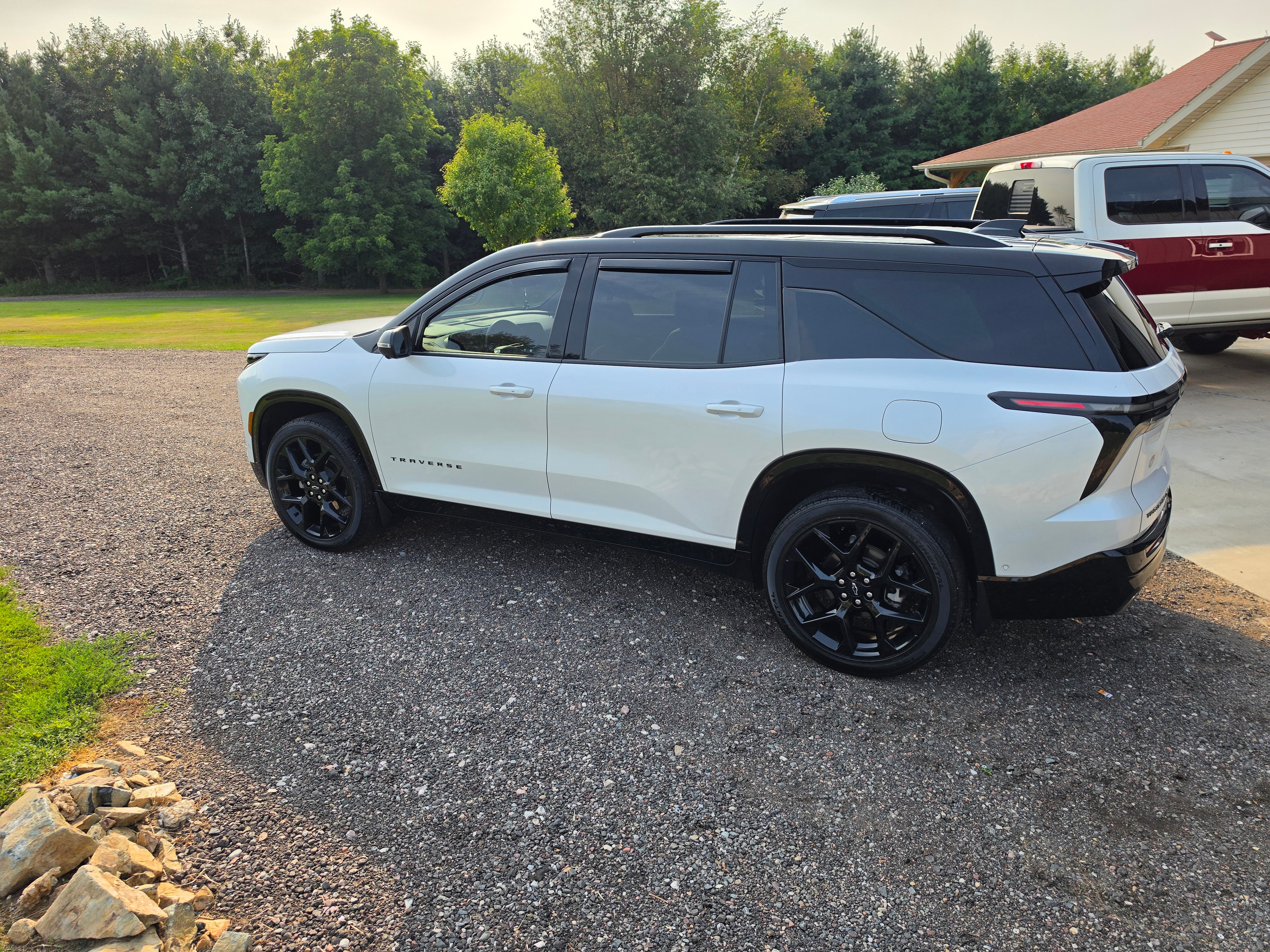 Partial vinyl wrap on white Chevrolet Traverse rear view — VR Restoration Marathon WI