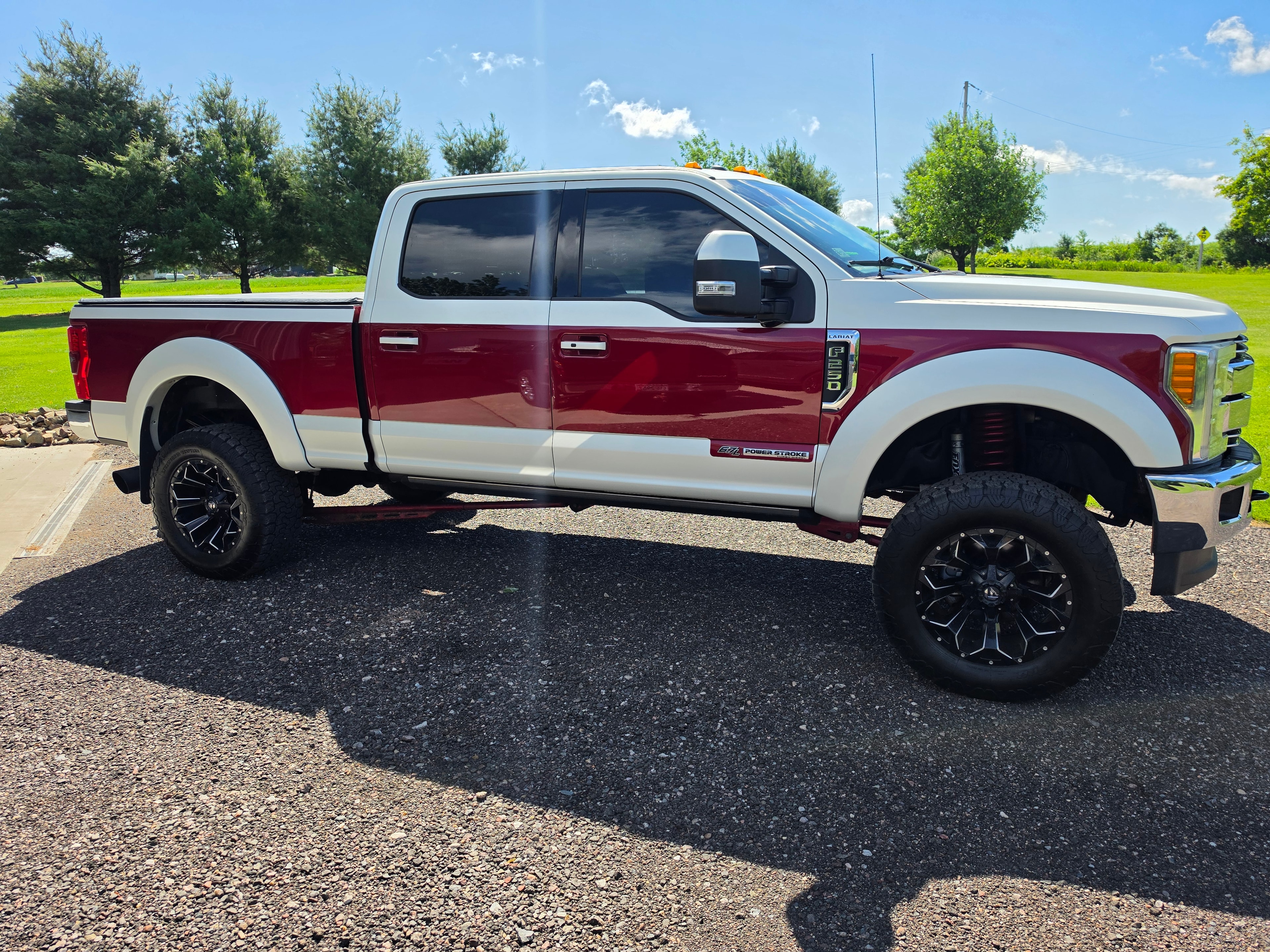 Partial vinyl wrap two-tone red and white on lifted Ford F-250 Super Duty — VR Restoration Marathon WI