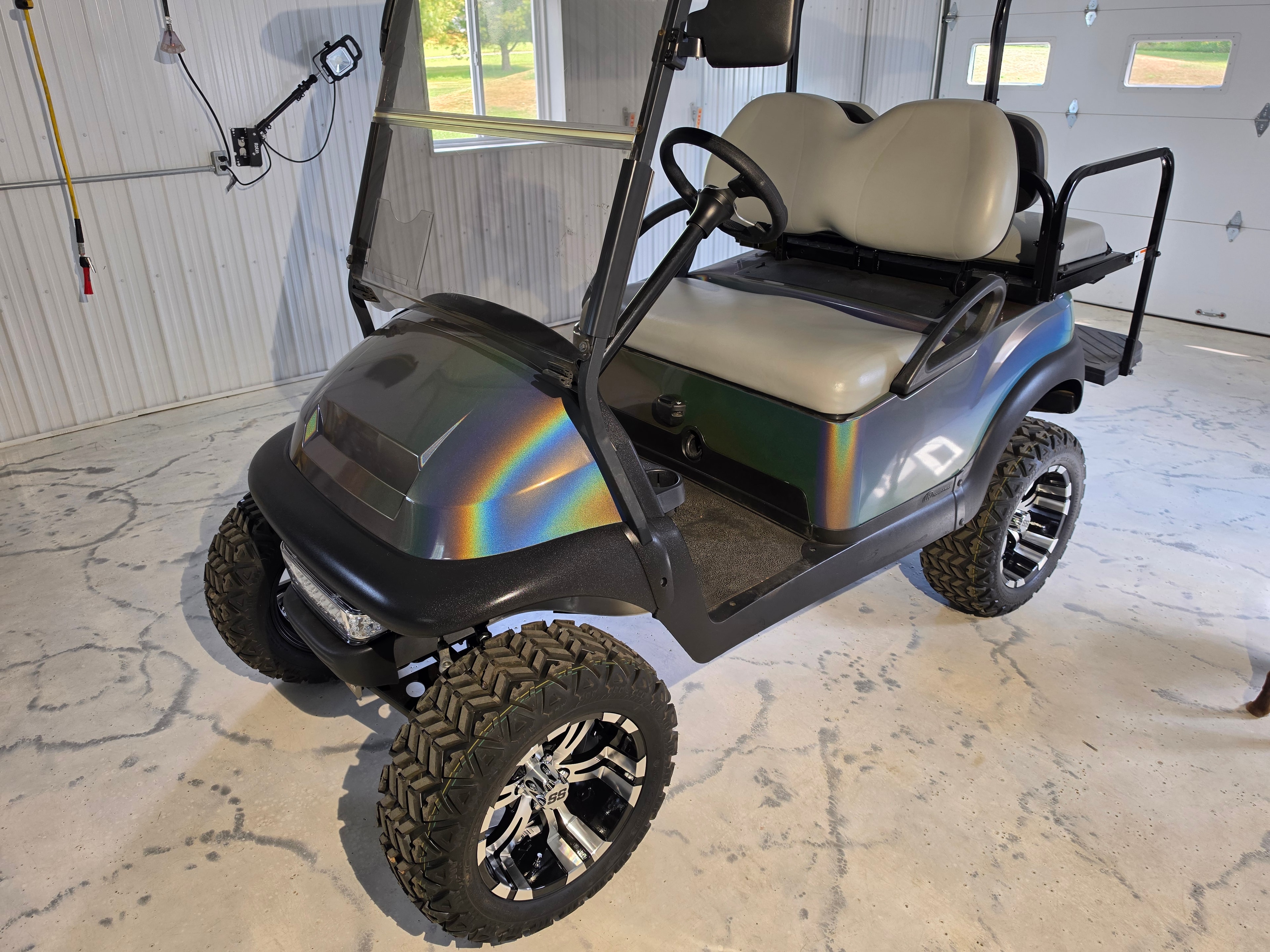 Full holographic rainbow vinyl wrap on lifted golf cart — VR Restoration Marathon WI