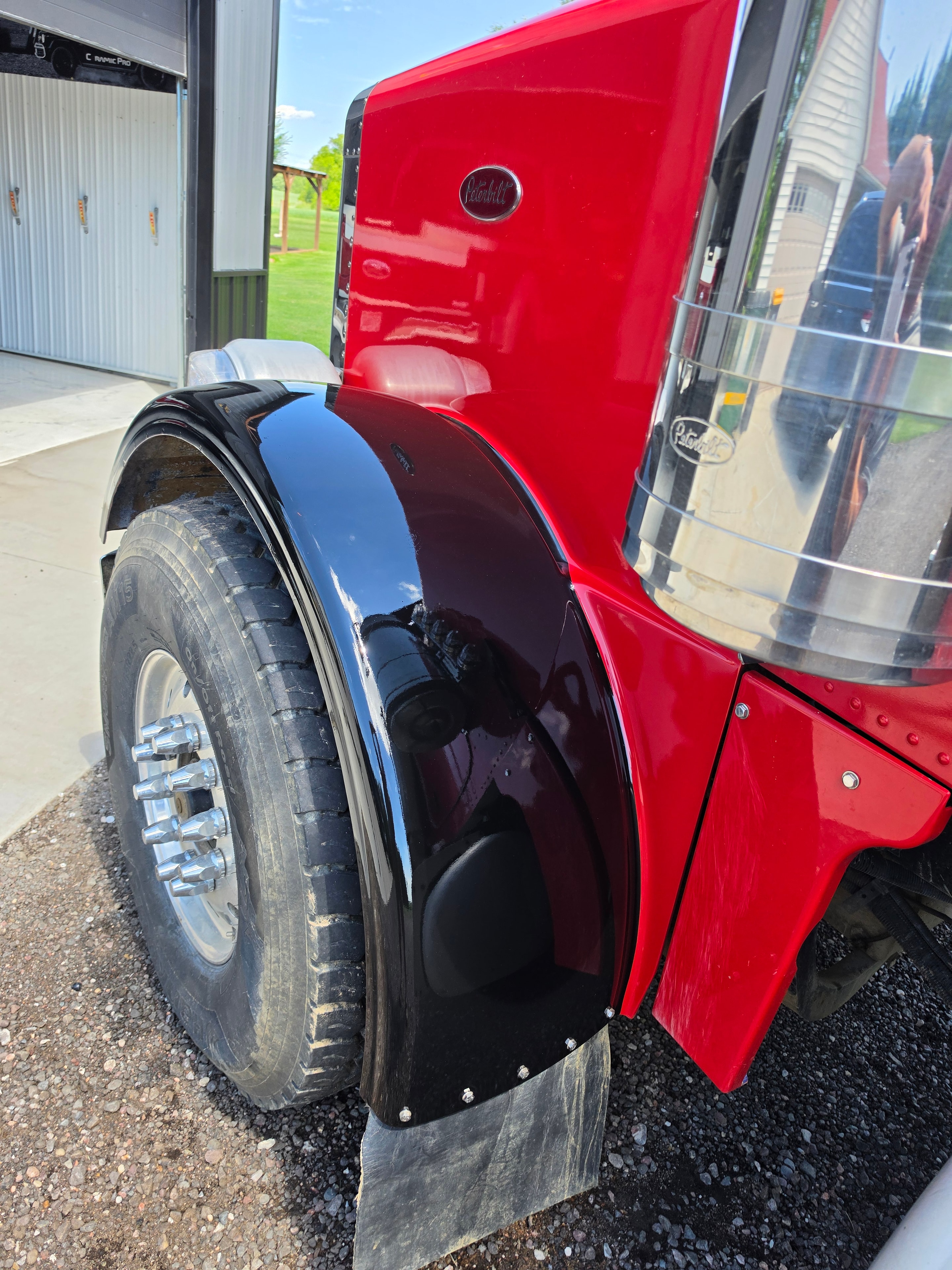Partial fender vinyl wrap gloss black on red Peterbilt semi truck — VR Restoration Marathon WI
