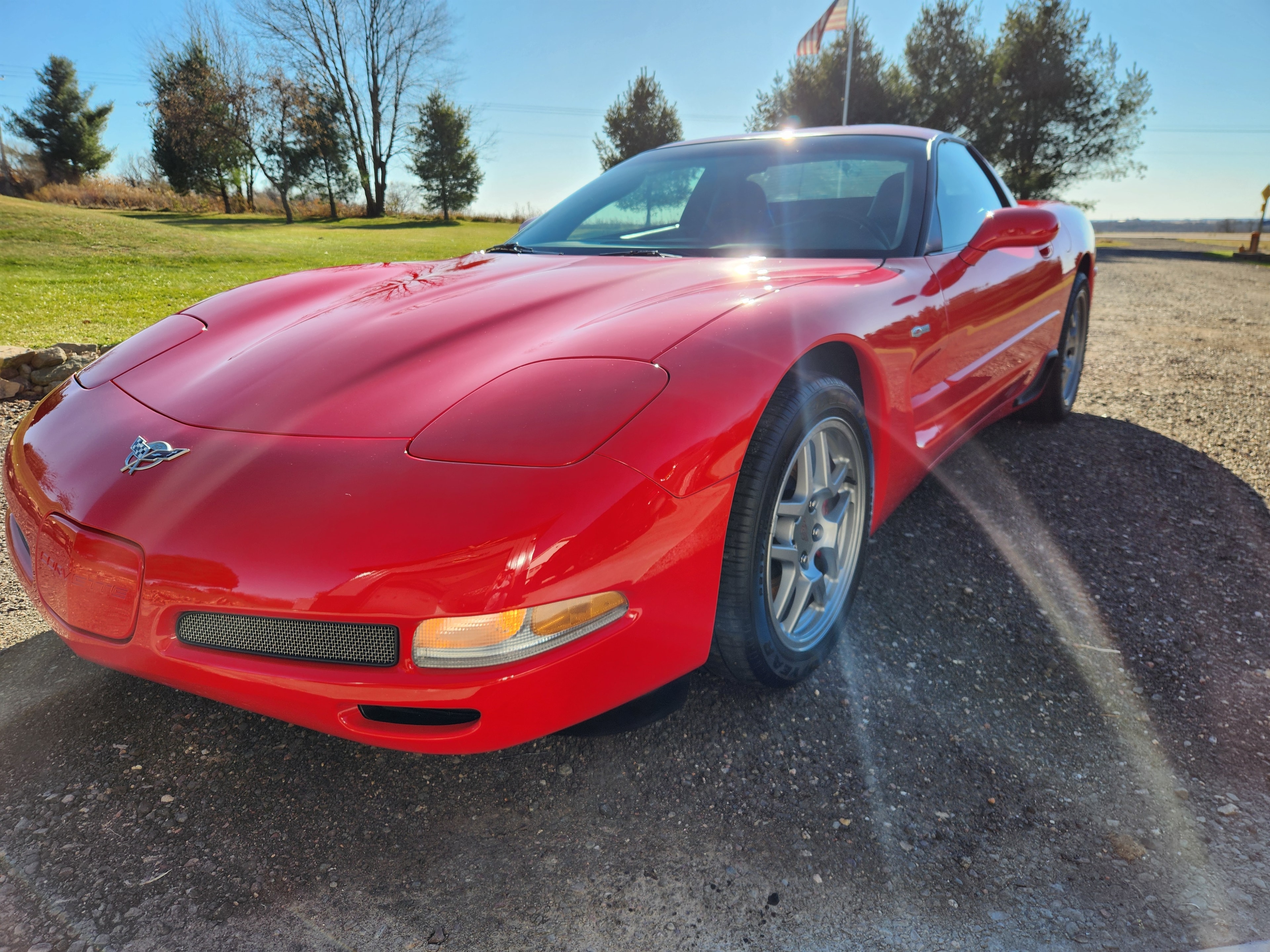 Partial paint protection film PPF on red Chevrolet Corvette C5 front end — VR Restoration Marathon WI