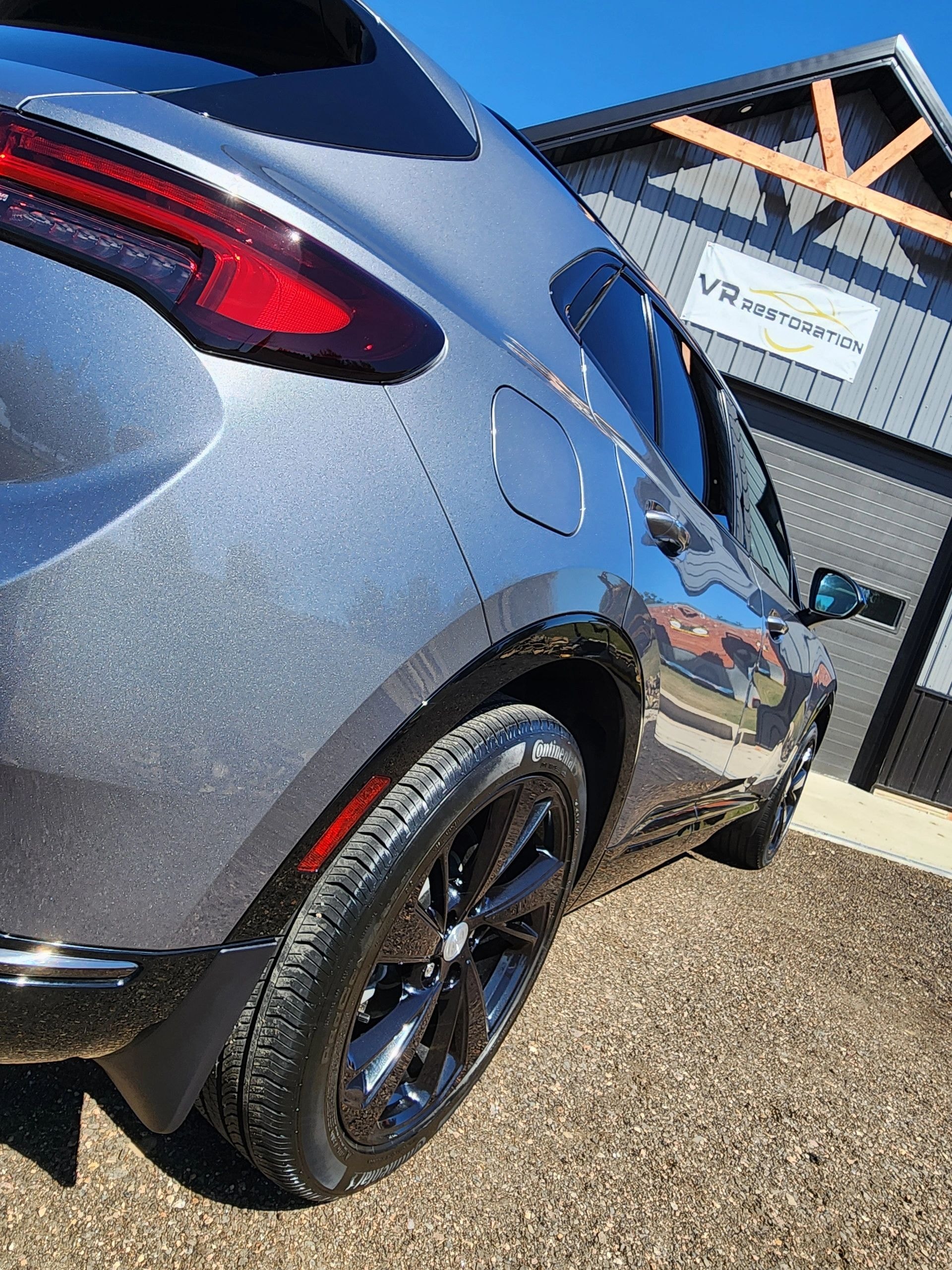 Ceramic Pro coating on blue sedan — VR Restoration Marathon WI