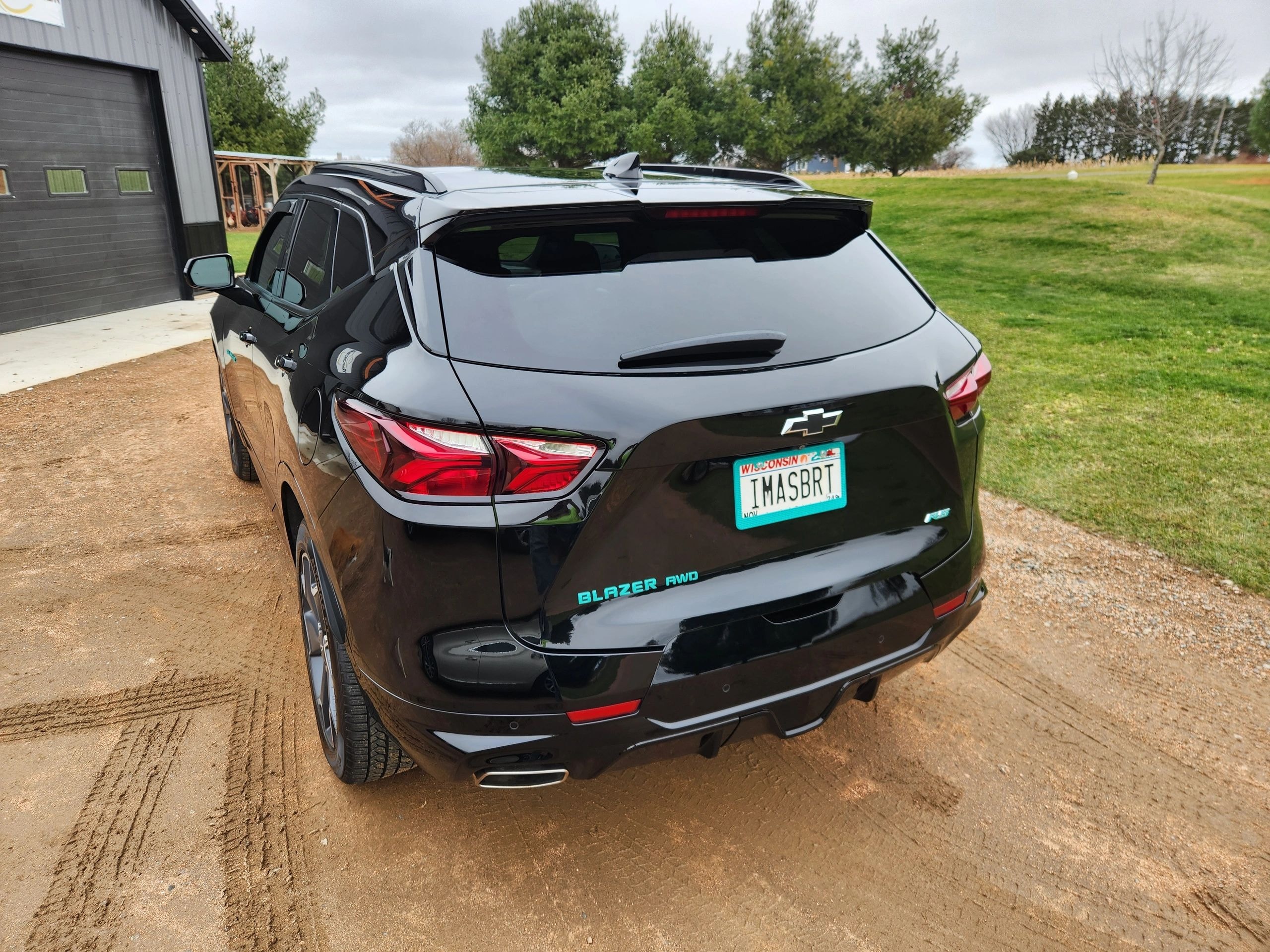 Ceramic Pro coating on black Chevrolet Blazer with turquoise accents — VR Restoration Marathon WI