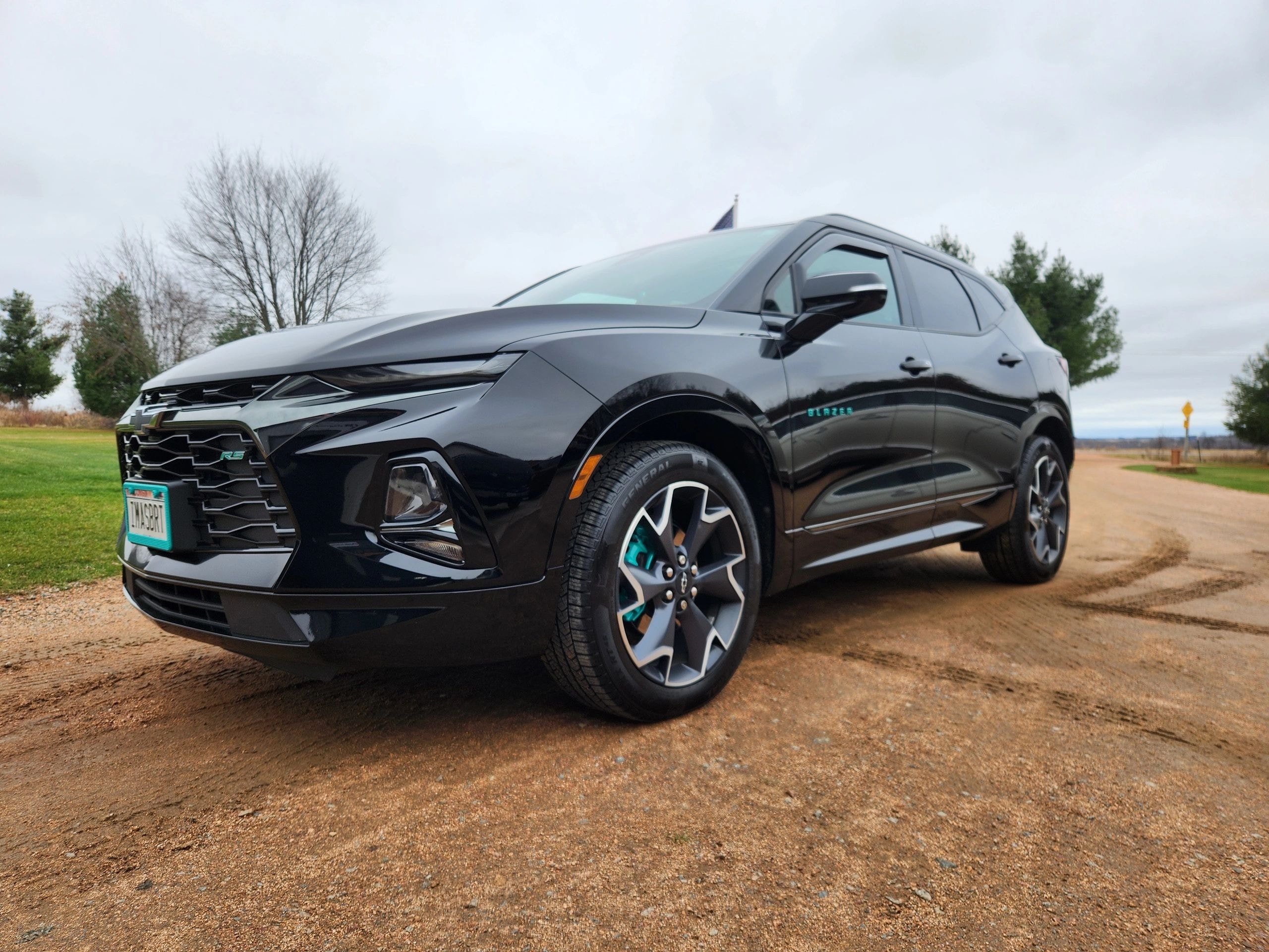Ceramic Pro coating on black Chevrolet Blazer EV with turquoise accents — VR Restoration Marathon WI