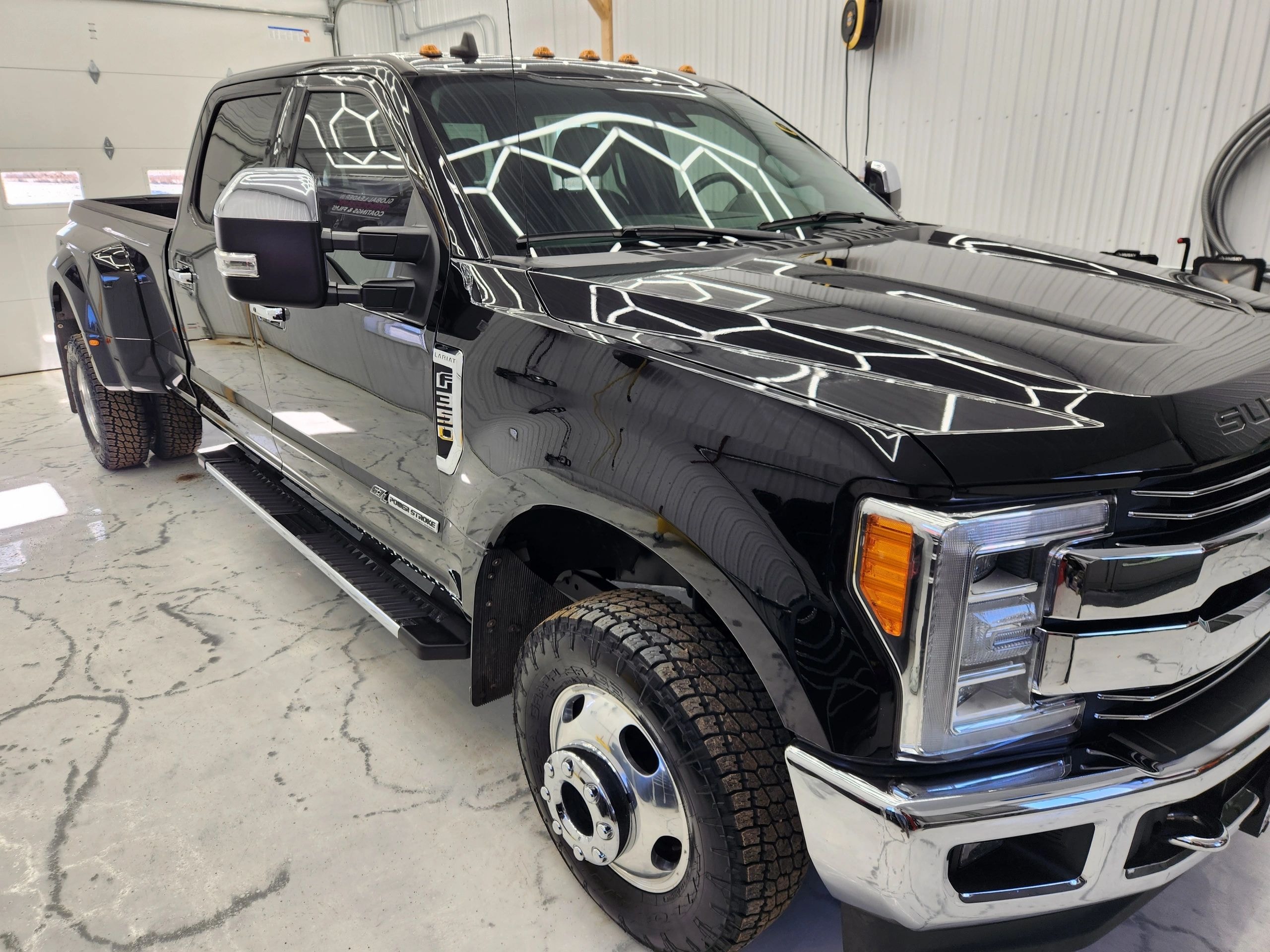 Ceramic Pro coating on black pickup truck — VR Restoration Marathon WI