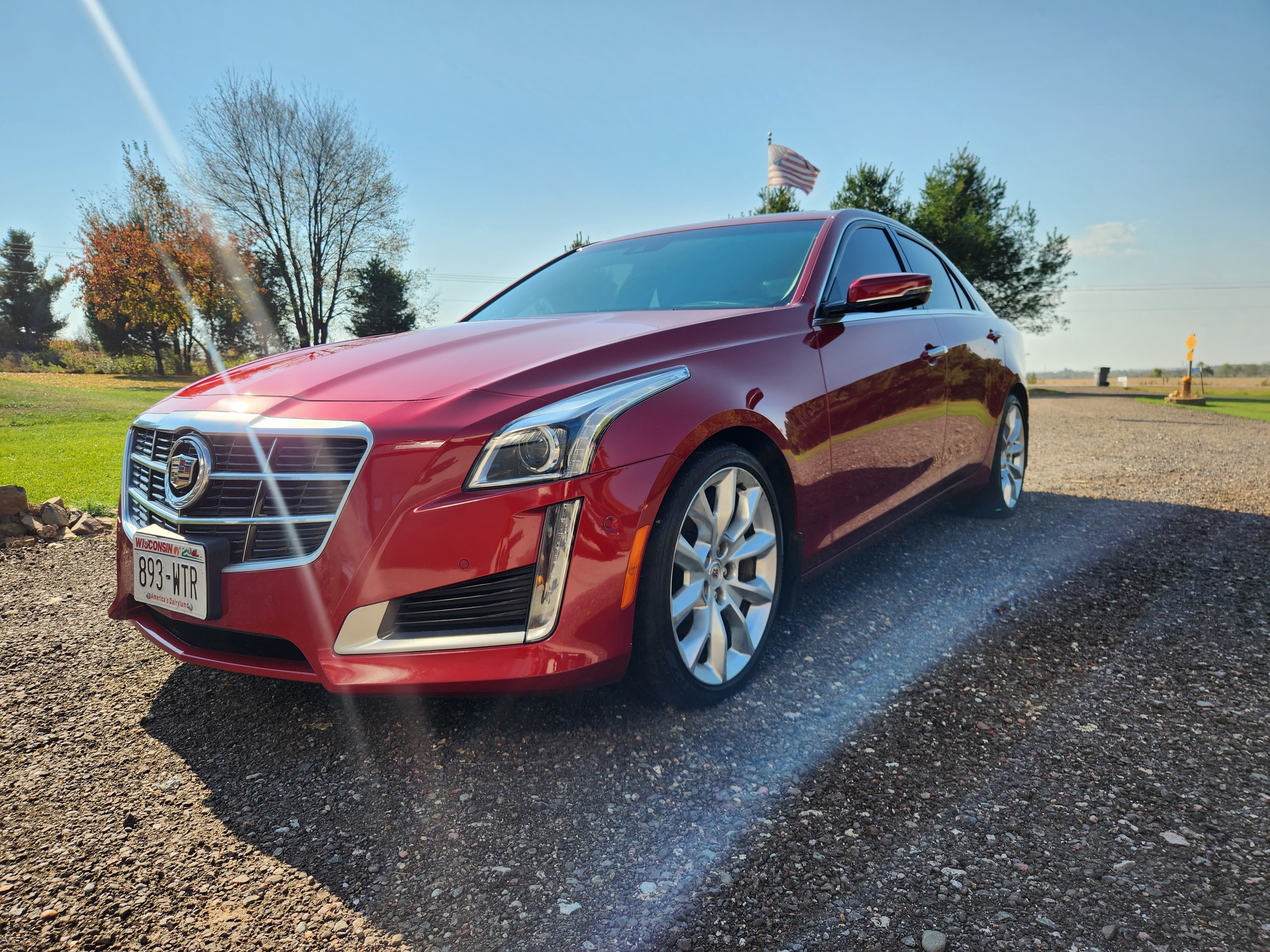 Ceramic Pro Gold Package coating on red Cadillac CTS — front angle — VR Restoration Marathon WI