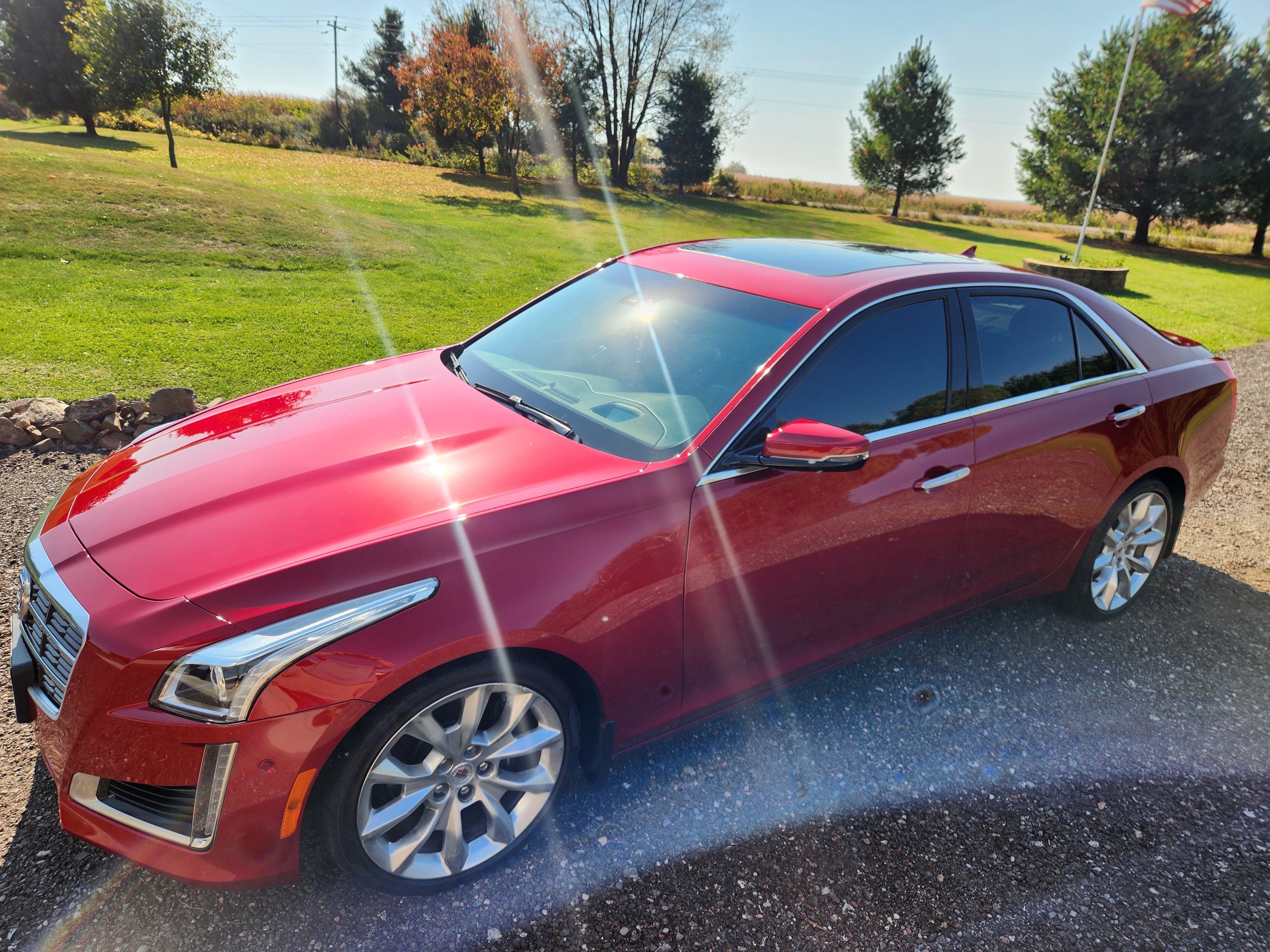 Ceramic Pro Gold Package coating on red Cadillac CTS — overhead side angle — VR Restoration Marathon WI